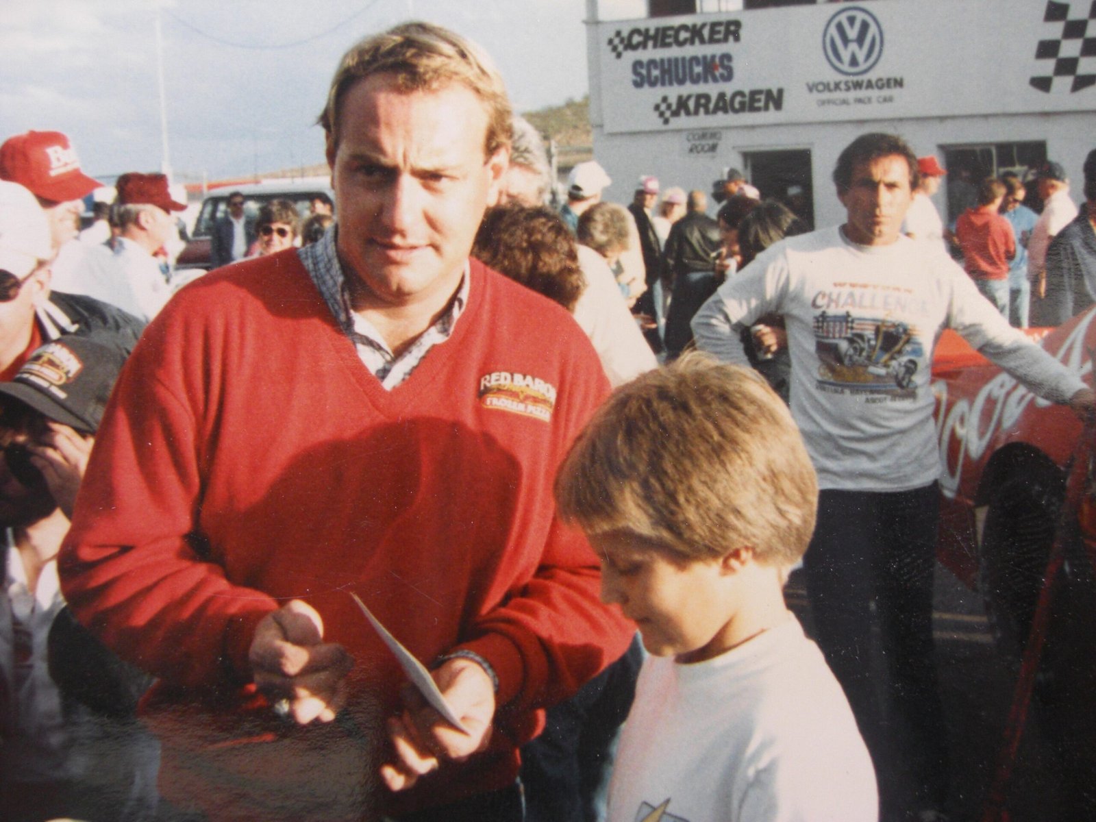 Young J. J. Yeley Taking Autograph And His Father Cactus Jacky In the Background